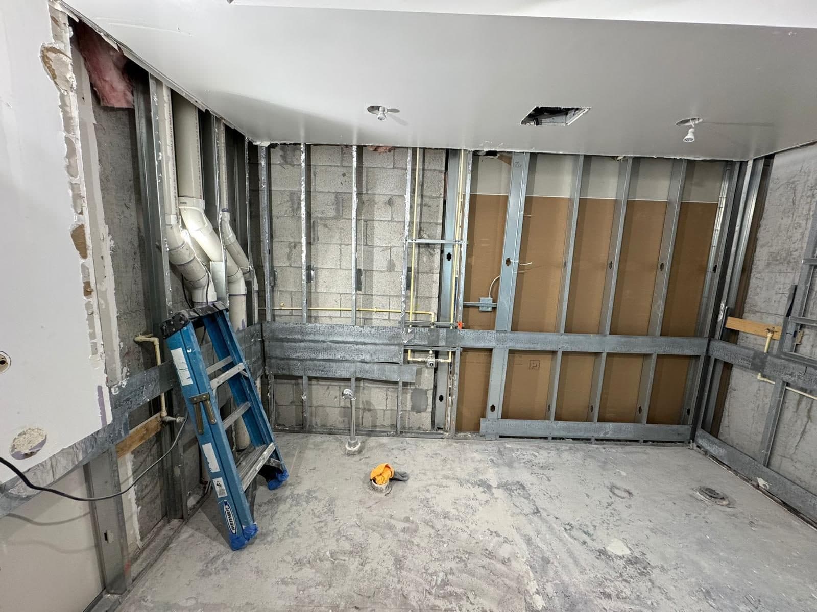 Metal stud framing with the mechanical and electrical rough-in exposed before close-up